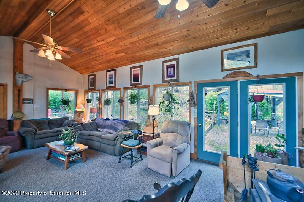 69-71 Timbertop Trail Newfoundland, PA 18445 - Photo 44 of 137 a living room with furniture and a large window