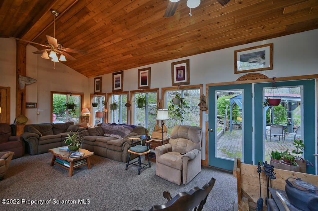 69-71 Timbertop Trail Newfoundland, PA 18445 - Photo 45 of 137 a living room with furniture and a large window