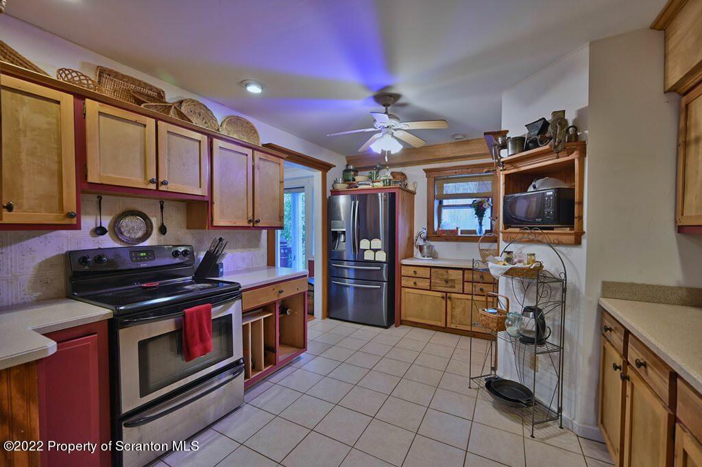 69-71 Timbertop Trail Newfoundland, PA 18445 - Photo 54 of 137 a kitchen with a stove top oven and refrigerator