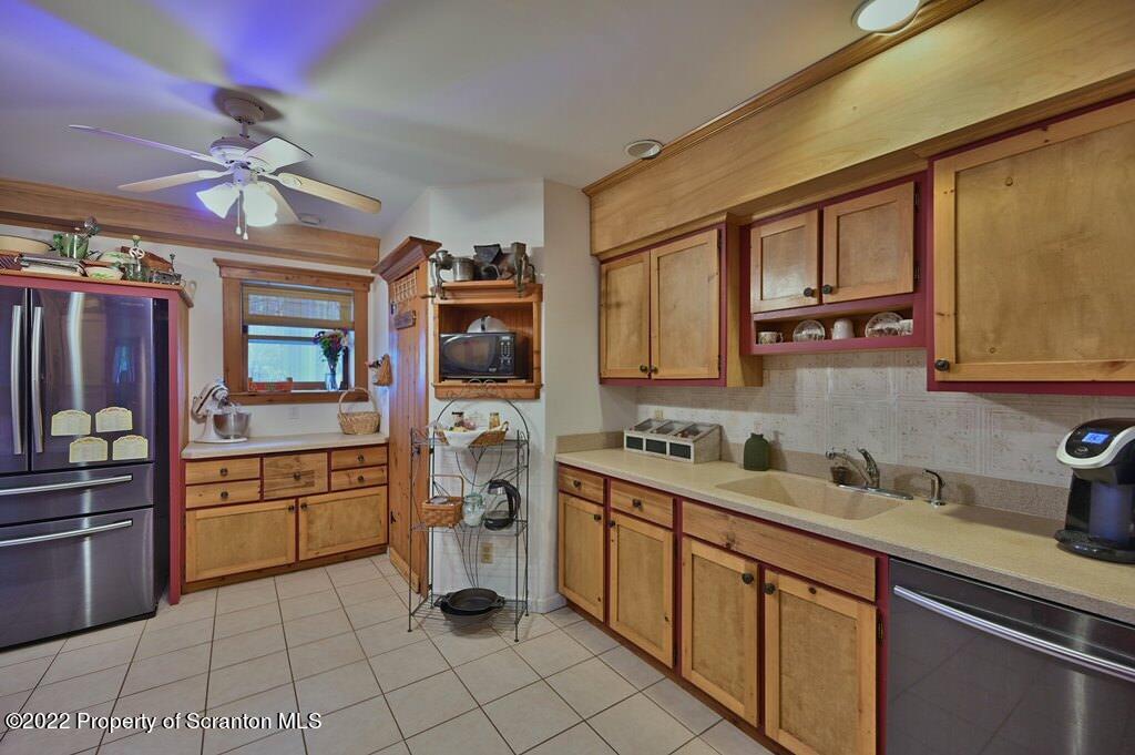 69-71 Timbertop Trail Newfoundland, PA 18445 - Photo 55 of 137 a kitchen with a sink cabinets and window