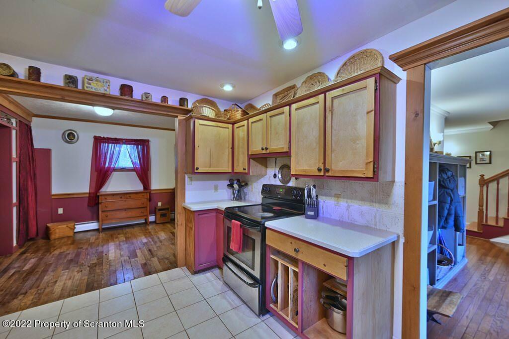 69-71 Timbertop Trail Newfoundland, PA 18445 - Photo 59 of 137 a open kitchen with stainless steel appliances granite countertop a stove a sink and a microwave