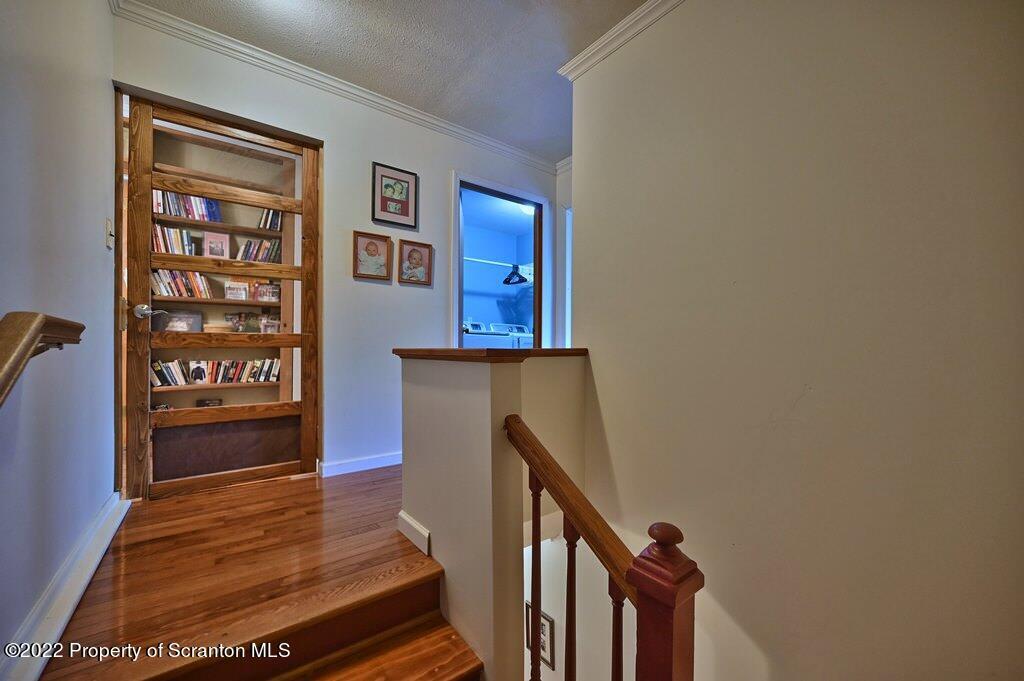 69-71 Timbertop Trail Newfoundland, PA 18445 - Photo 74 of 137 a view of a hallway with wooden floor and staircase