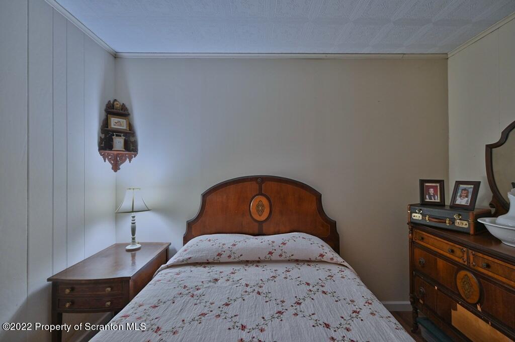 69-71 Timbertop Trail Newfoundland, PA 18445 - Photo 94 of 137 a bedroom with a bed and a lamp on dresser