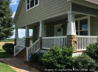 a view of a house with a small yard