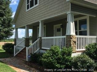 a view of a house with a small yard