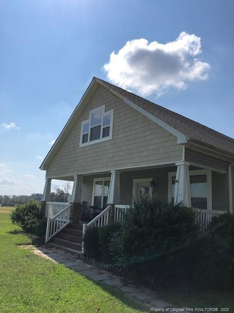 9167 Deep Branch Road Pembroke, NC 28372 - Photo 13 of 24 a front view of house with yard and green space