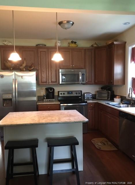 9167 Deep Branch Road Pembroke, NC 28372 - Photo 15 of 24 a kitchen with kitchen island a sink table and chairs