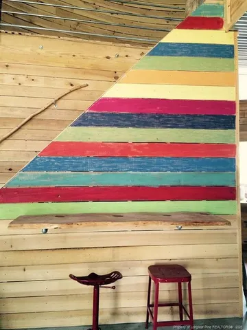 a room with pool and wooden floor