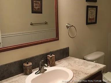 9167 Deep Branch Road Pembroke, NC 28372 - Photo 9 of 24 a bathroom with a granite countertop sink and a mirror