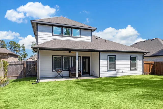 a bedroom with a bed and a chair in it