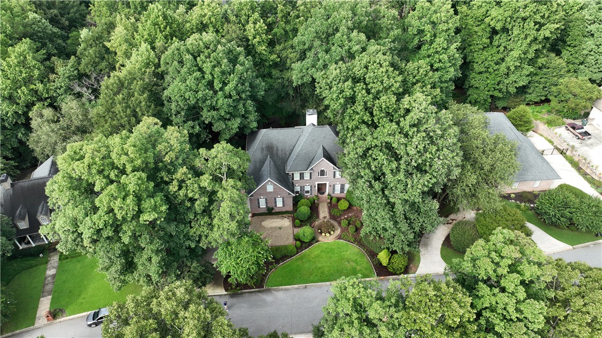 106 Red Maple Way Clemson, SC 29631 - Photo 43 of 49 Mature trees frame this brick residence with a neatly manicured lawn and private circular driveway.