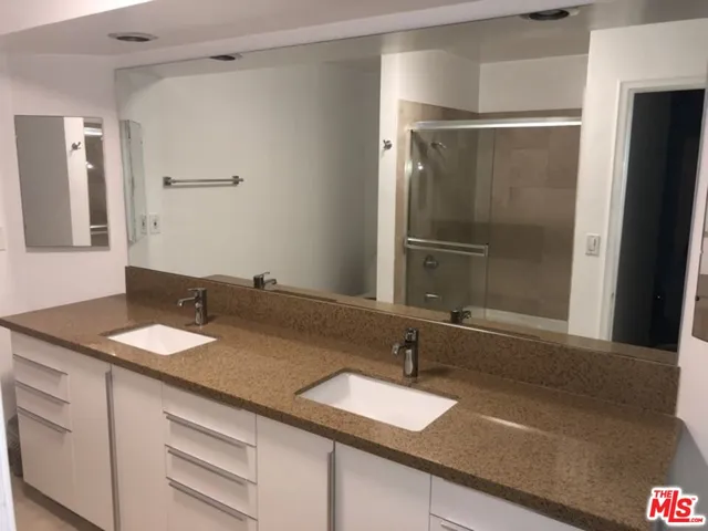 a view of a patio with lawn chairs next to a yard