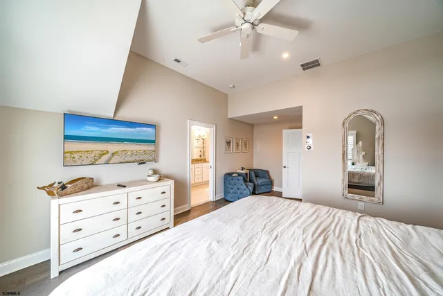 a bedroom with a bed and a dresser