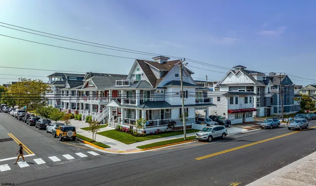 a view of multiple houses with a street