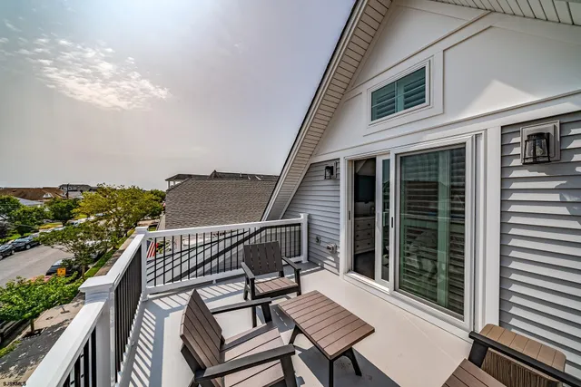 a view of a balcony with furniture