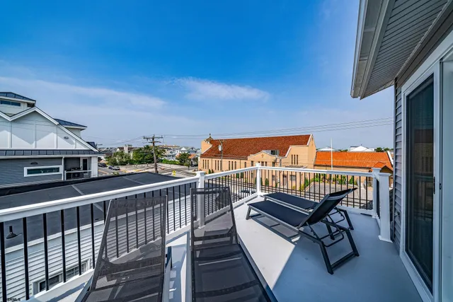 a view of balcony with furniture