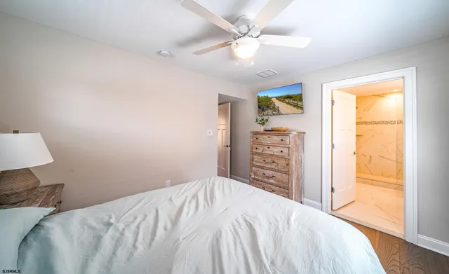 a bedroom with a bed dresser and a window