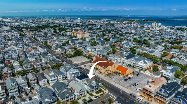an aerial view of a city with ocean view