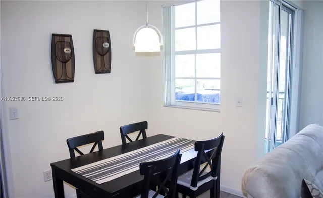 a bedroom with a bed and a lamp