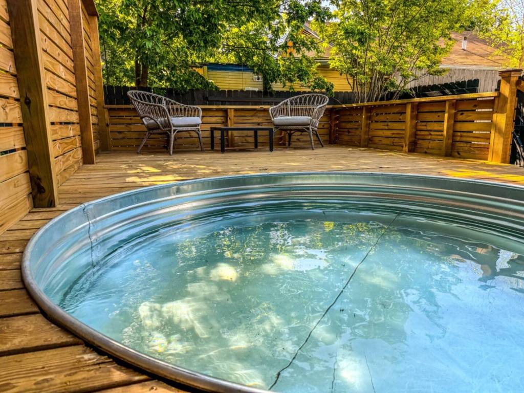 2402 Santa Rita Street Austin, TX 78702 - Photo 13 of 17 View of pool featuring a deck and a jacuzzi