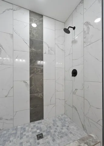 a bathroom with a granite countertop sink and vanity