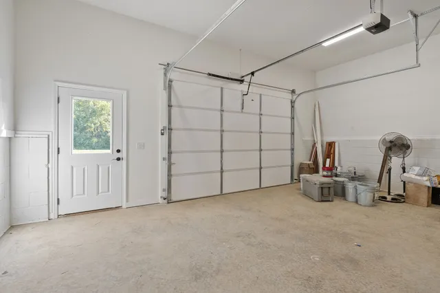 a view of room with stairs and windows