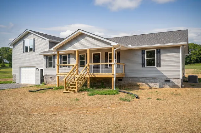 a house with yard in front of it