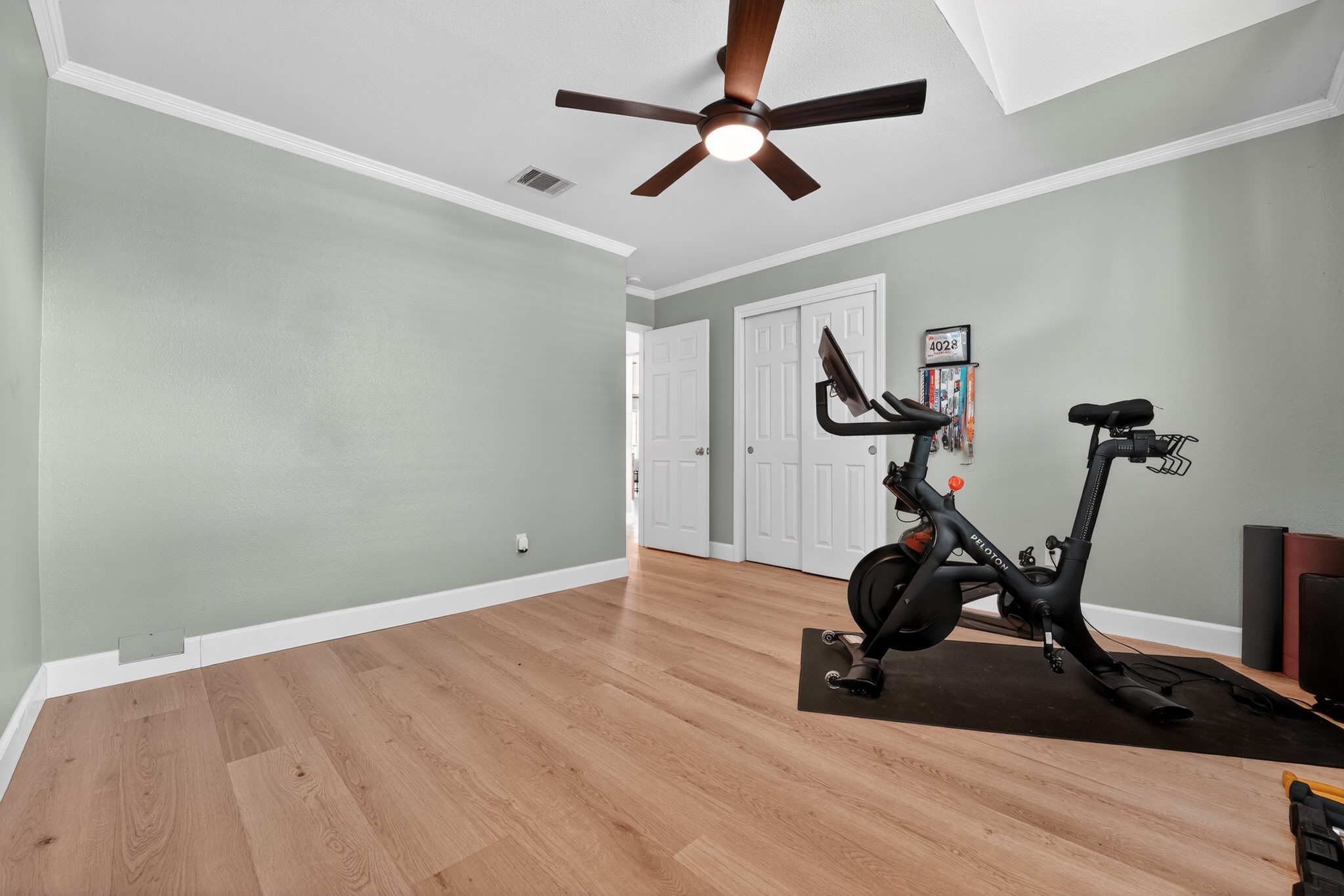 1811 Old Mill Road Cedar Park, TX 78613 - Photo 27 of 39 Hardwood flooring extends throughout this versatile room, illuminated by a central ceiling fan.