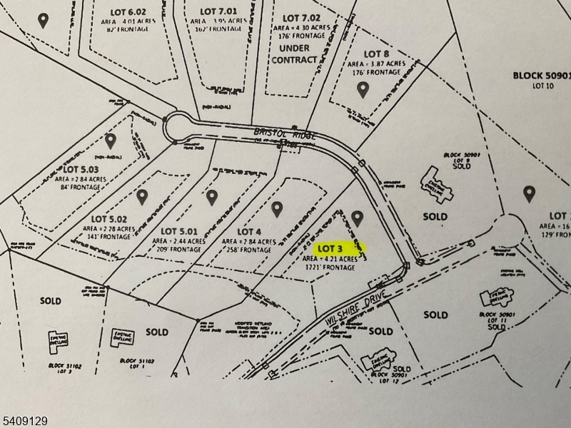 a view of a room with white walls