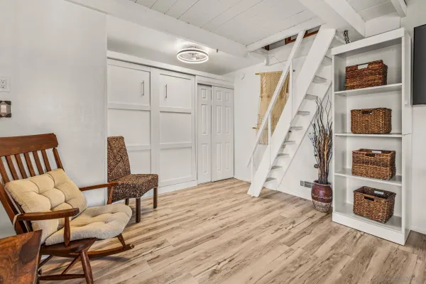 a spacious bedroom with a bed and a large window