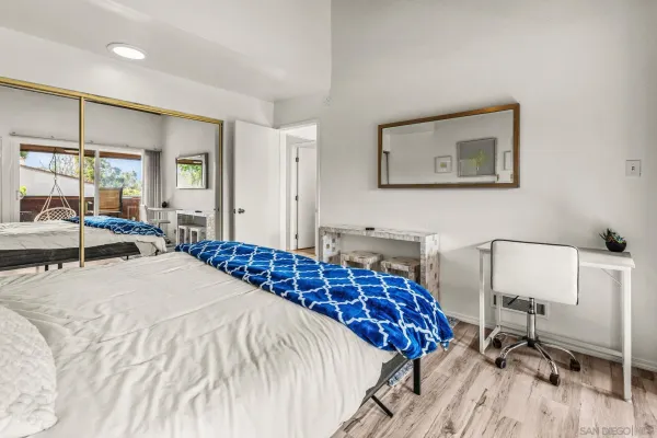 a bed sitting in a room next to a window