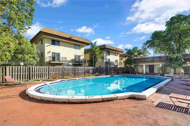 a view of a house with swimming pool