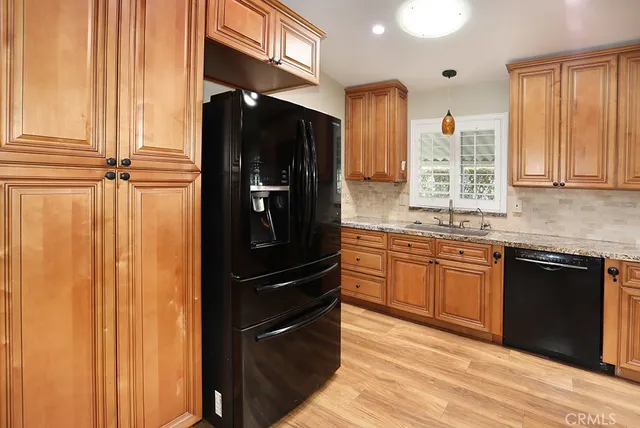 a view of an room with wooden floor and chandelier