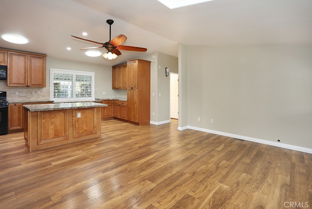 61 Saddleback Road Tustin, CA 92780 - Photo 18 of 49 a view of a kitchen with a sink hardwood floor and a window