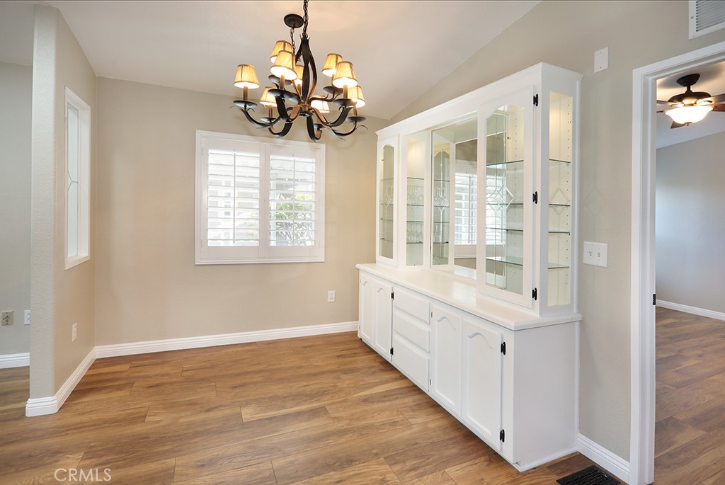 61 Saddleback Road Tustin, CA 92780 - Photo 19 of 49 a large white room with windows and chandelier