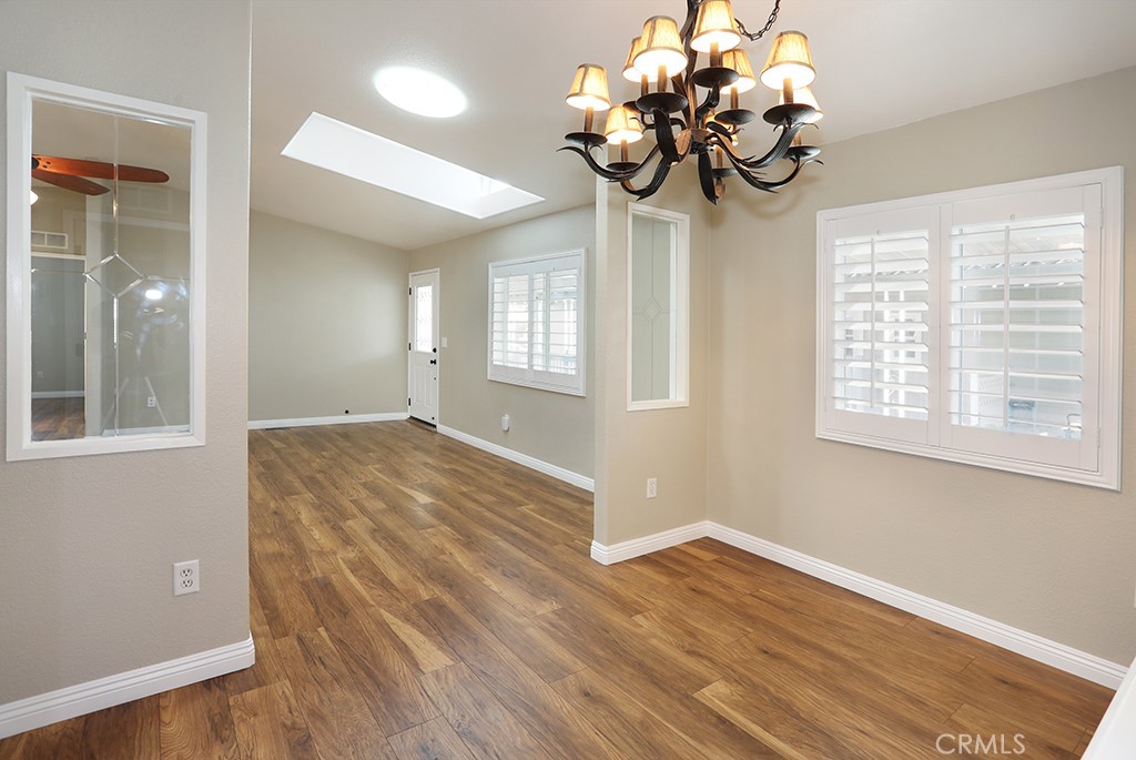 61 Saddleback Road Tustin, CA 92780 - Photo 20 of 49 a view of an room with wooden floor and chandelier