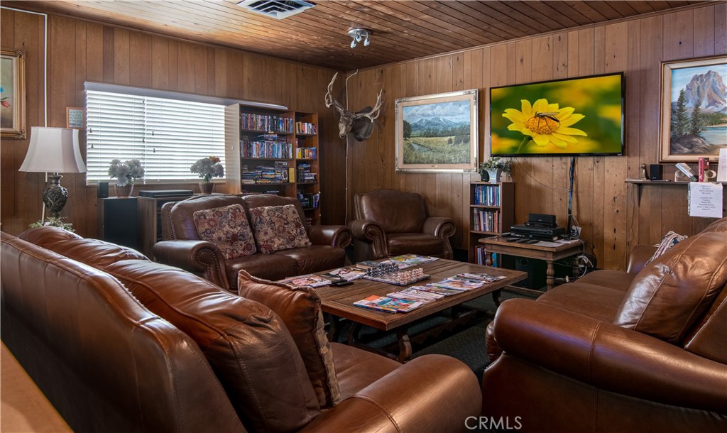 61 Saddleback Road Tustin, CA 92780 - Photo 21 of 49 a living room with furniture a flat screen tv and a window