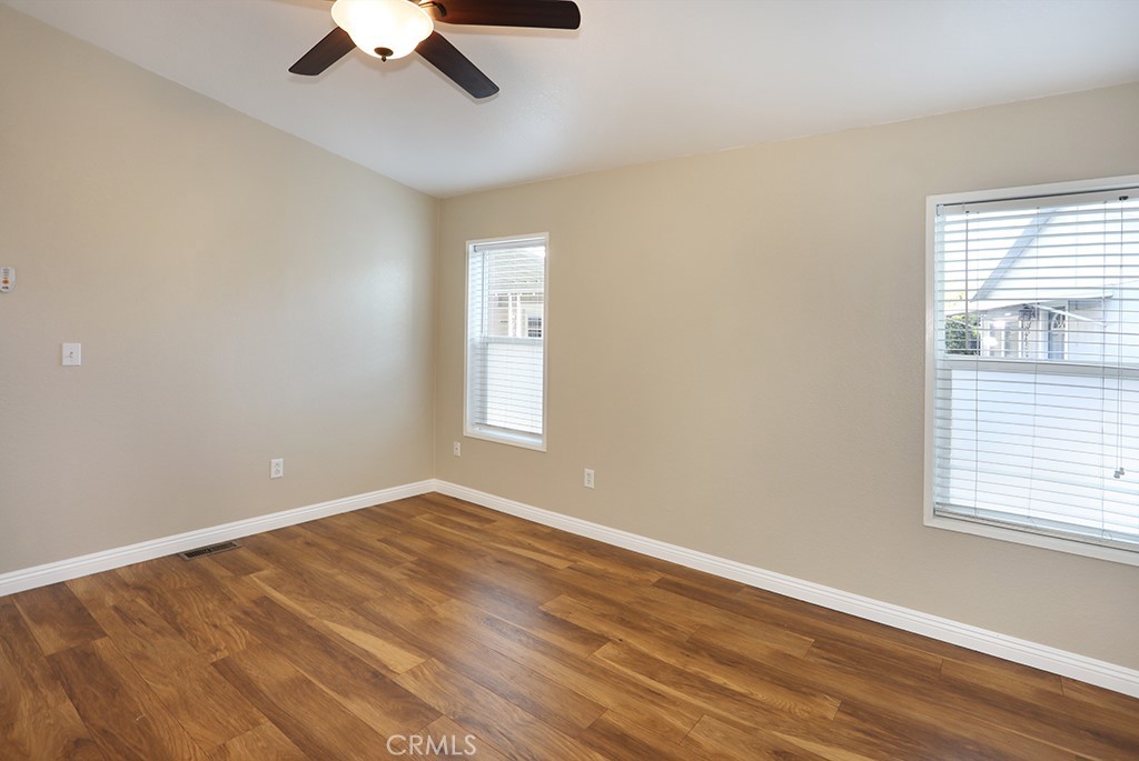 61 Saddleback Road Tustin, CA 92780 - Photo 26 of 49 an empty room with a window and a ceiling fan