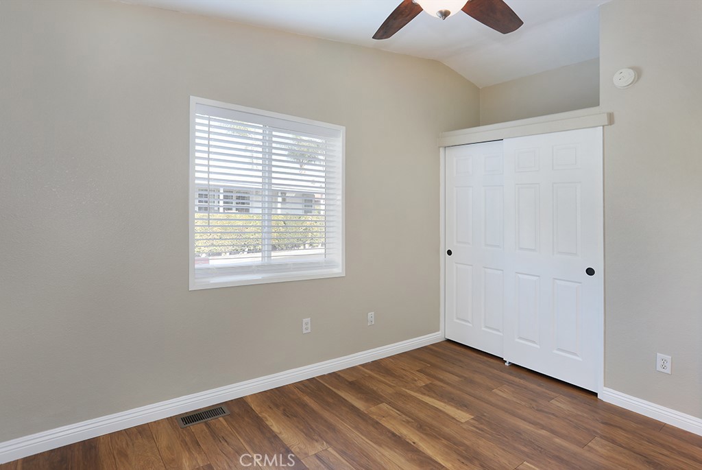 61 Saddleback Road Tustin, CA 92780 - Photo 27 of 49 a view of an empty room with window and wooden floor