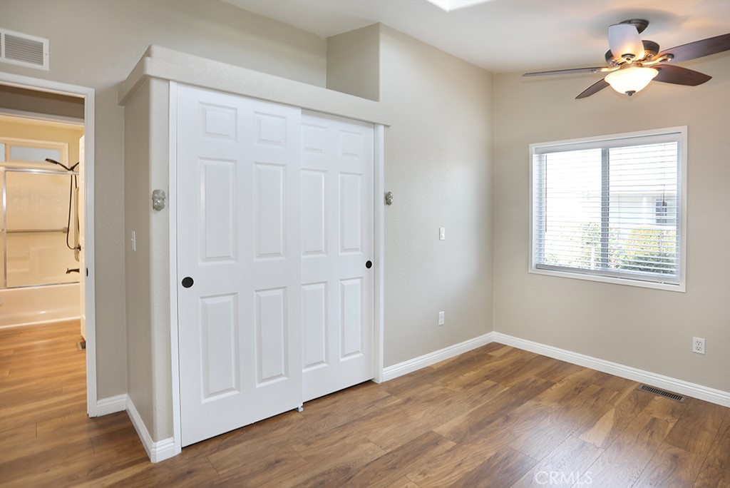 61 Saddleback Road Tustin, CA 92780 - Photo 30 of 49 a view of empty room with wooden floor and fan