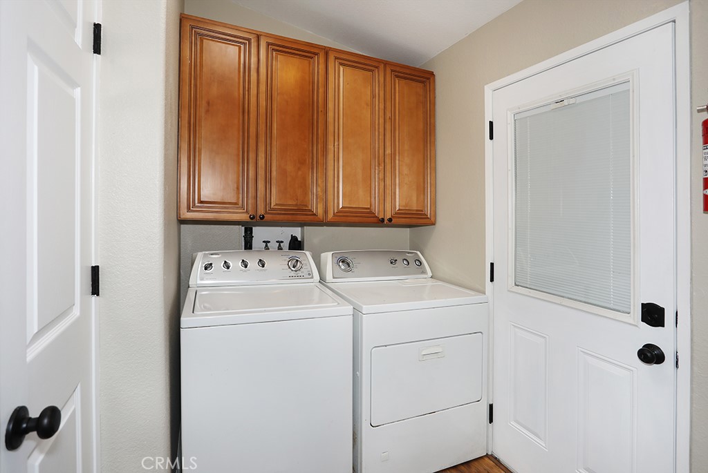 61 Saddleback Road Tustin, CA 92780 - Photo 32 of 49 a utility room with dryer and washer