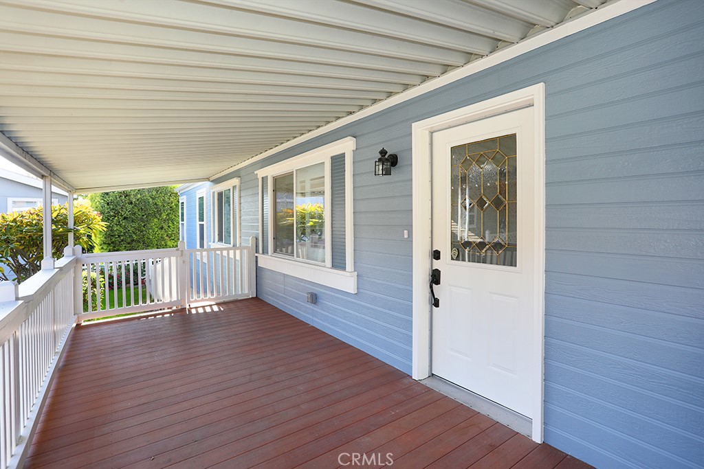 61 Saddleback Road Tustin, CA 92780 - Photo 34 of 49 an empty room with wooden floor and windows