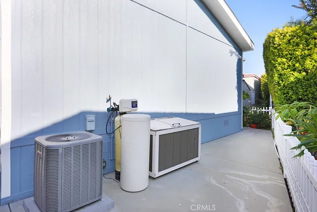 a view of a porch with a table and chairs