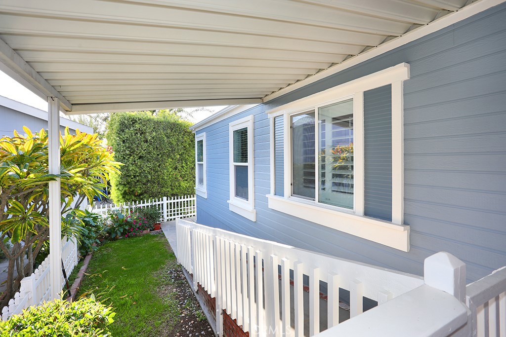 61 Saddleback Road Tustin, CA 92780 - Photo 45 of 49 a view of a porch with a table and chairs