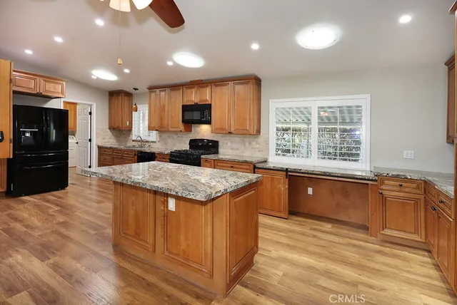 a view of wooden floor and windows in a room
