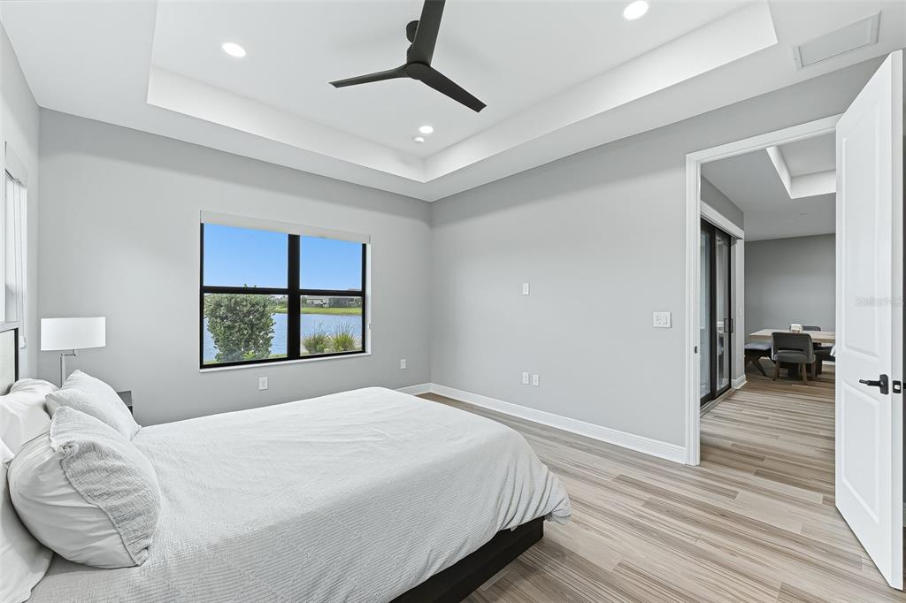 4191 Pegasus Way Naples, FL 34120 - Photo 18 of 48 a bedroom with a bed and a large window