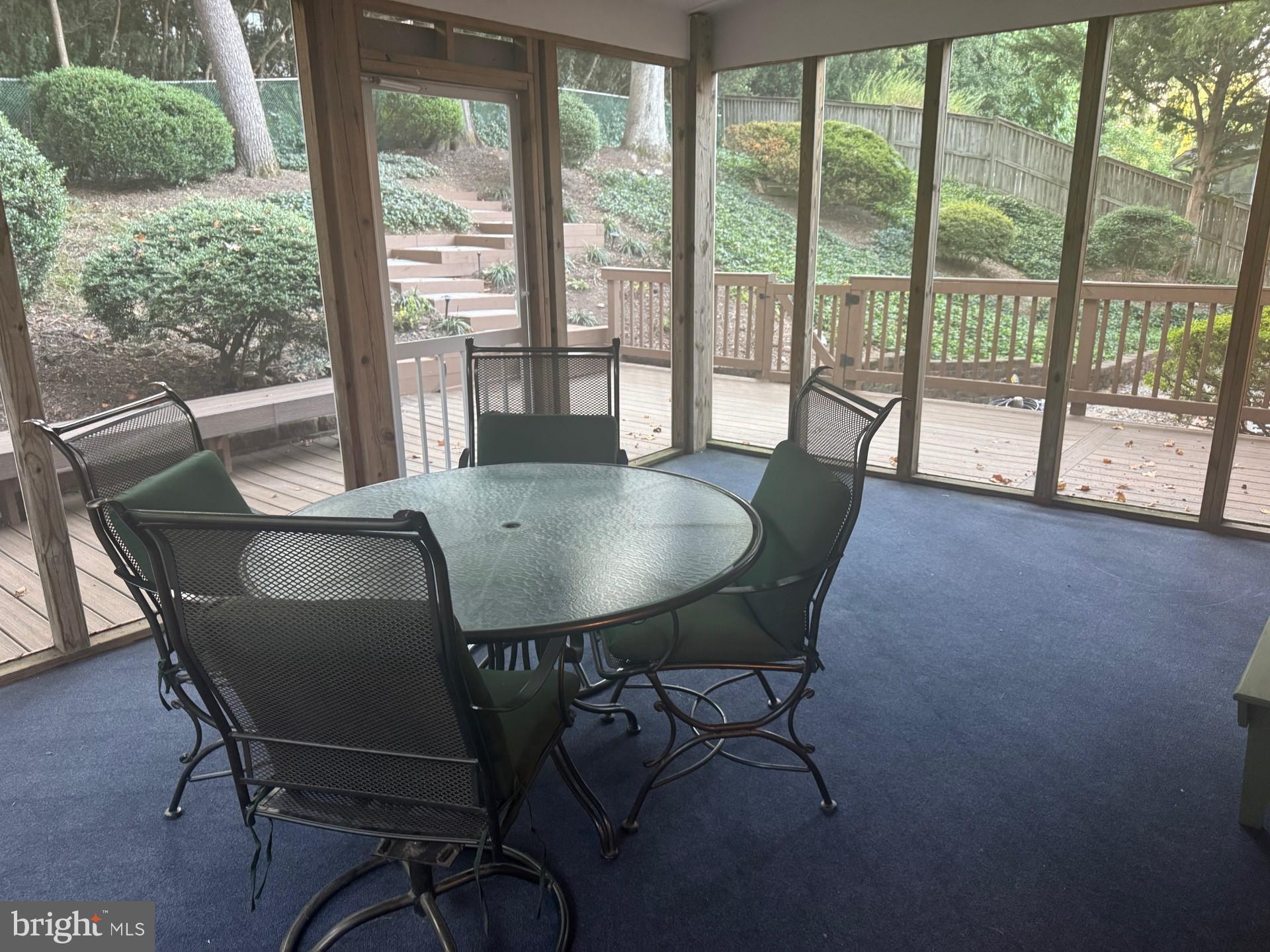 3312 Midland Road Fairfax, VA 22031 - Photo 8 of 12 Serene sunroom with lush garden views.