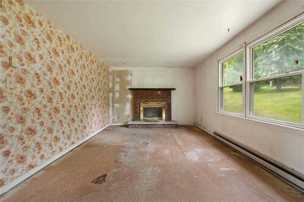 724 Camp Meeting Road Sewickley, PA 15143 - Photo 11 of 32 a view of empty room with window and fireplace