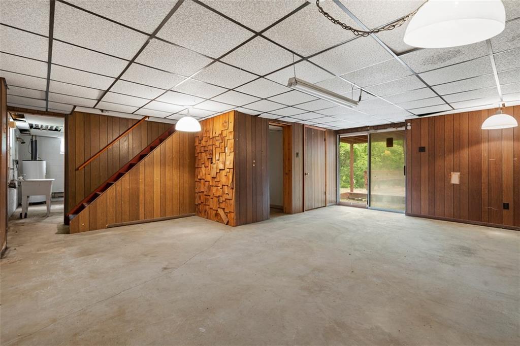 724 Camp Meeting Road Sewickley, PA 15143 - Photo 27 of 32 a view of an empty room with wooden walls