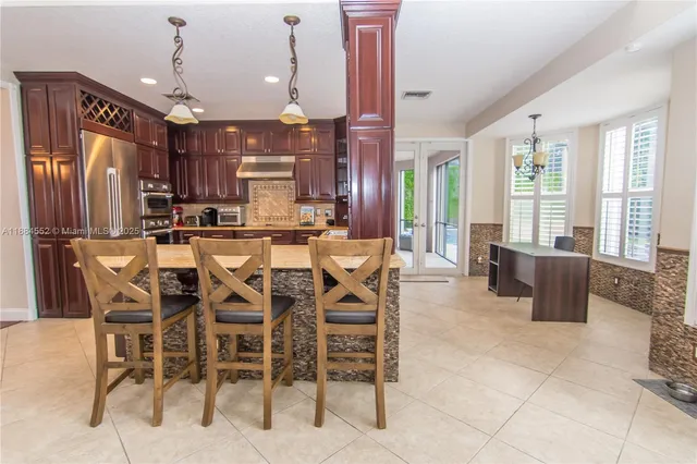 a view of a dining room with furniture window and outside view